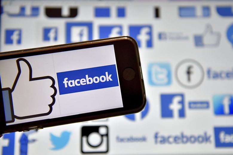 A picture taken on Dec. 28, 2016, in Vertou, western France, shows logos of Facebook.